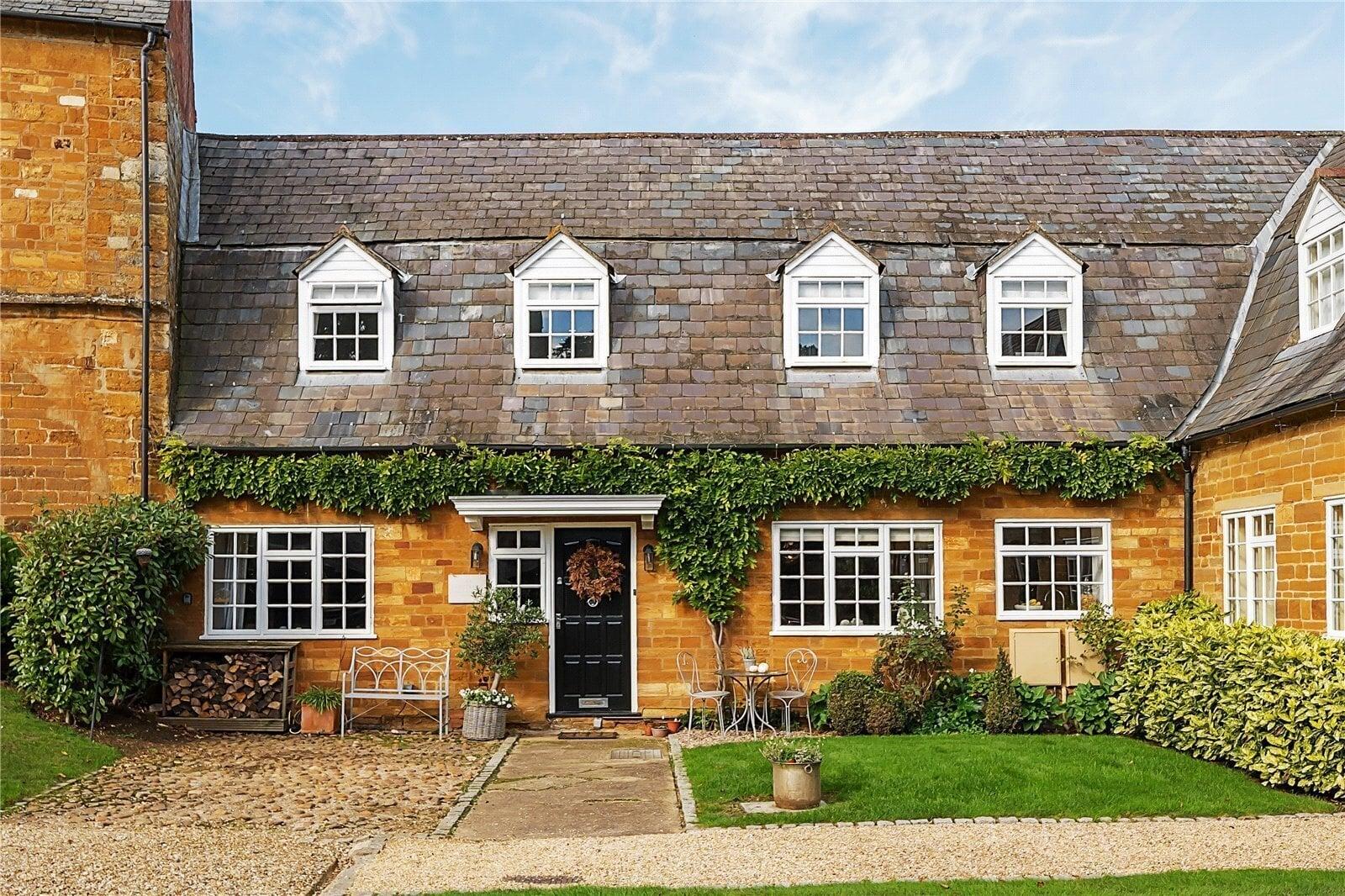Row of elegant English townhouses at golden hour