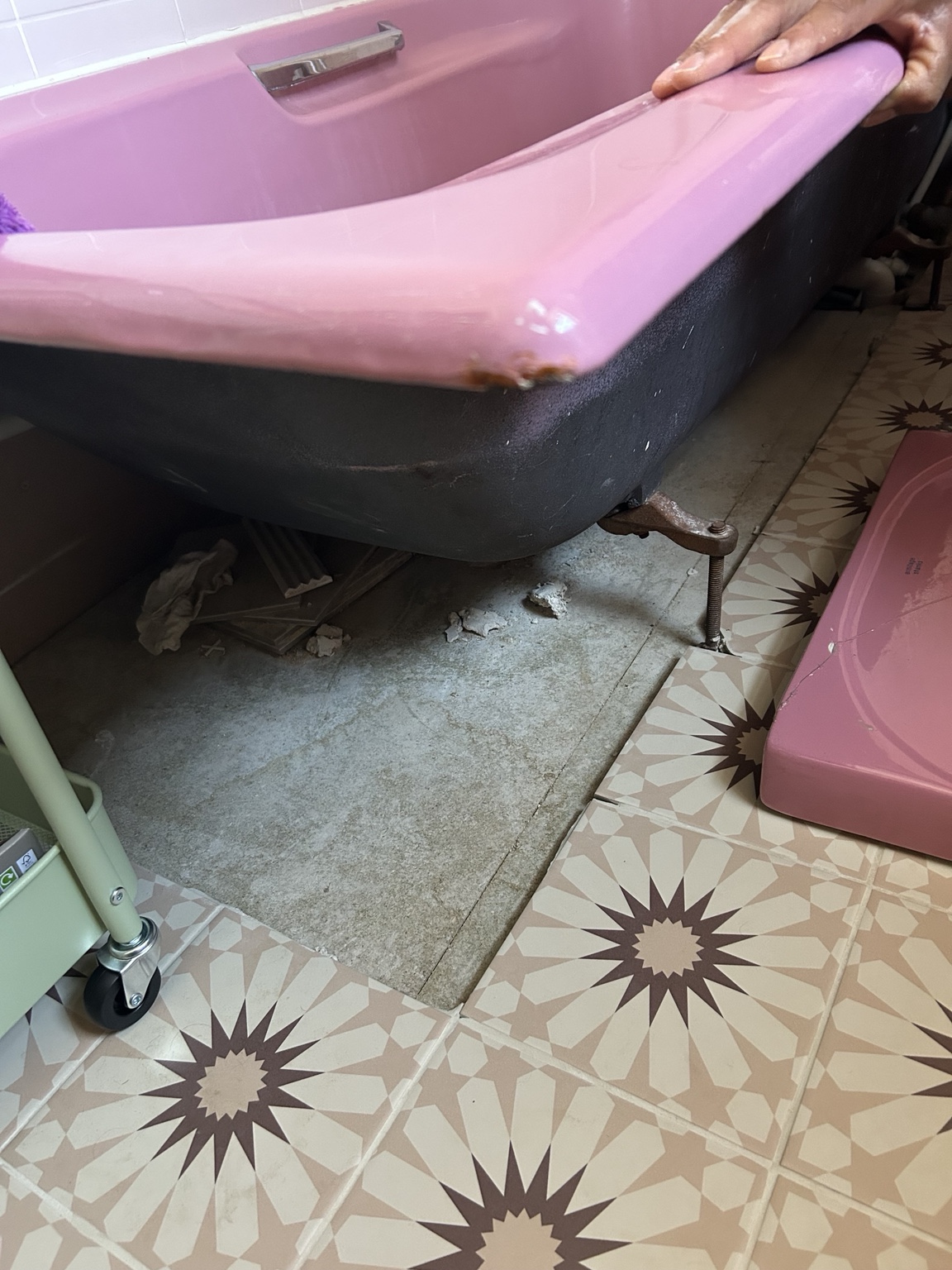 As we found it: open bath surround and incomplete flooring
